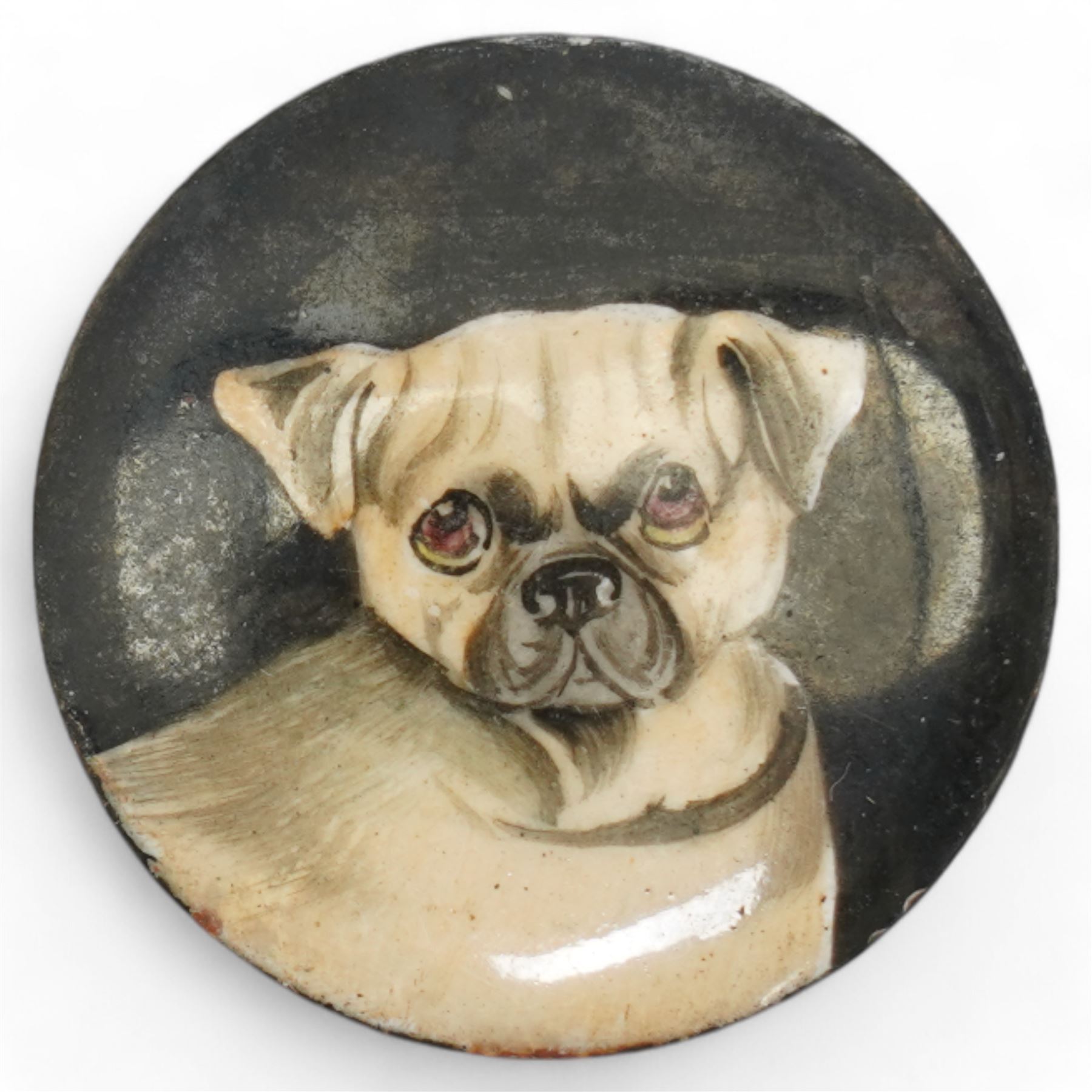 Three unmounted 19th century circular enamel discs, each painted with a portrait of a dog, comprising a Bloodhound after Sir Edwin Landseer, a Pug and a Terrier, all unsigned, D2.2cm (3)