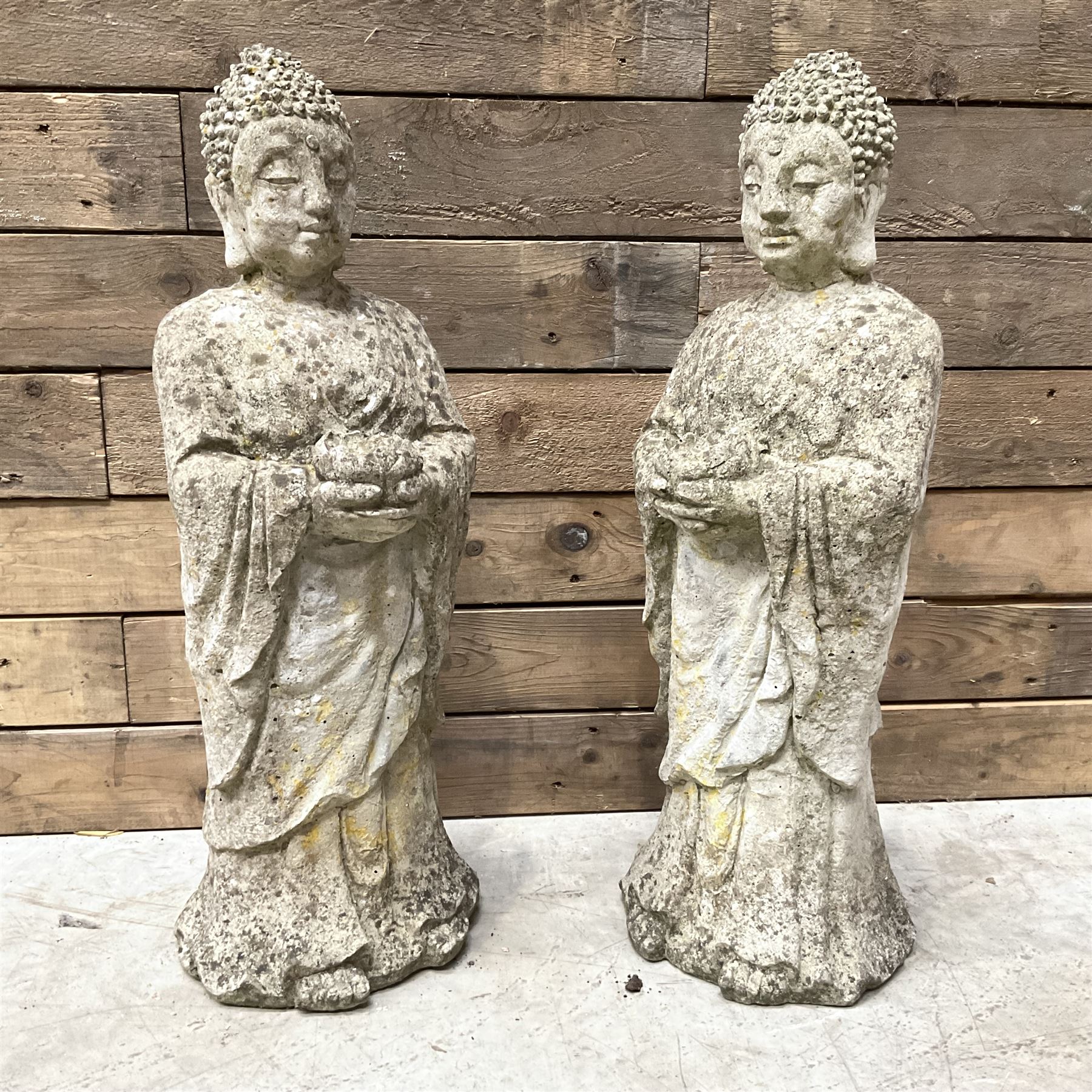 Pair of cast stone garden Buddahs