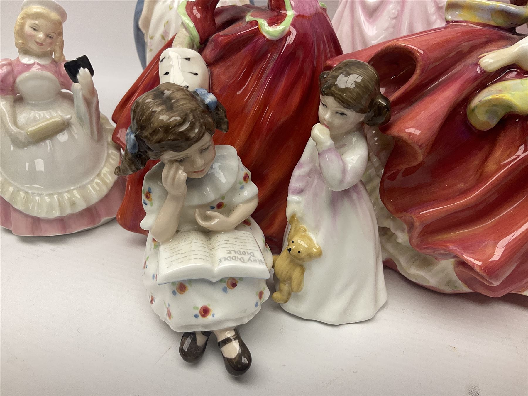 Nine Royal Doulton Figures including; Margarite HN1928, Autumn Breezes HN1034, Hope HN4097, Alison HN2336, Top of the Hill HN1834 and four others (9)