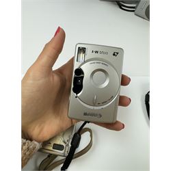 Eight Canon compact Ixus cameras, to include two Ixus examples serial nos. 2309147 & 2273184, Ixus M-1 serial no. 2932566, Ixus L-1 serial no. 2161988, Ixus Z90 serial no. 2201833,  Ixus X-1 serial no. 4704380, Z60IX serial no. 7474817, Ixus V2 serial no. 4431003237 and a Canon Powershot 350 digital camera serial no. H7MX00941