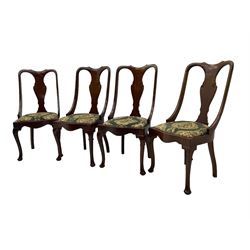 Set of eight late 19th century mahogany spoon back dining chairs, each with shaped top rail over Queen Anne design vase-shaped splat, upholstered seats in floral patterned fabric, raised on cabriole supports with scroll carved knees