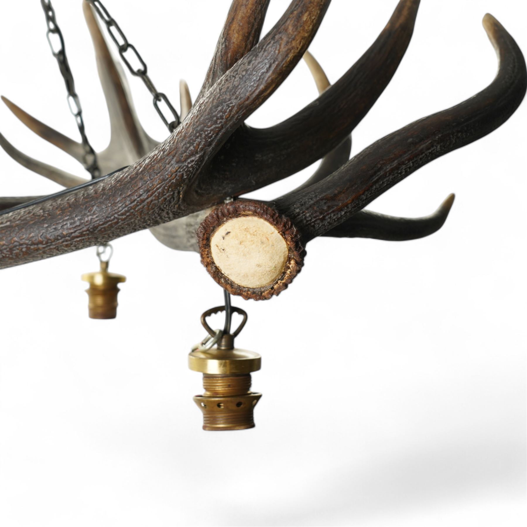 Deer antler chandelier, of triangular form, with three fitted hanging lights H45cm