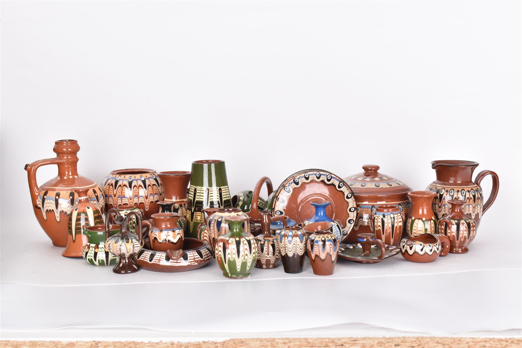 Collection of slipware, including miniature vases, baskets, candlesticks jugs etc 