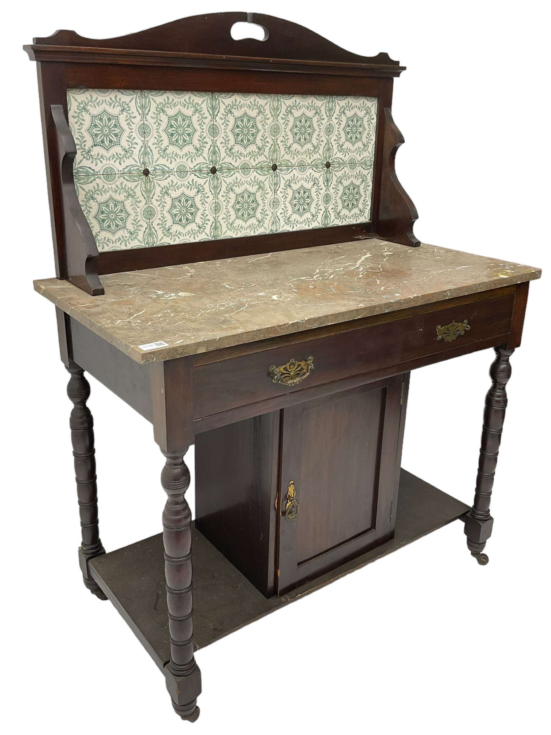 Edwardian walnut washstand, raised tiled back over marble table, fitted with single long drawer over panelled cupboard, on collar turned supports, brass and ceramic castors