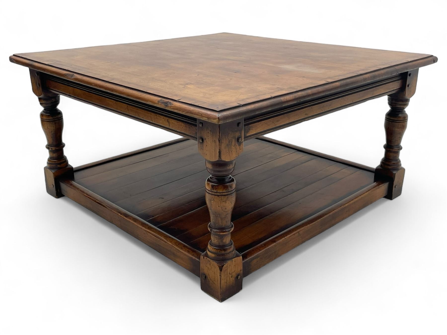 Square elm coffee table, square ovolo-moulded top with fruitwood band, turned supports united by undertier 