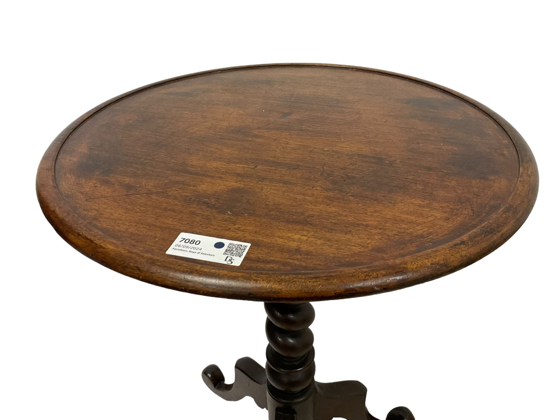 Victorian mahogany tripod table, dished circular top on spiral turned column, three splayed supports with scrolled terminals 