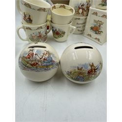 Royal Doulton Bunnykins teawares, including teacups and saucers, egg cup, money boxes etc (12)