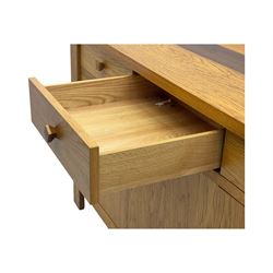 Contemporary oak sideboard, rectangular top with central contrasting plank, over three frieze drawers and three cupboards with enclosed shelving, on rectangular stile supports