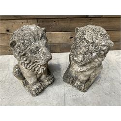 Pair of small weathered cast stone garden seated lions