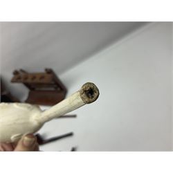 Collection of smoking pipes including Meerschaum pipe, carved as a female head, Briars and clay examples, etc and four pipe racks/stands