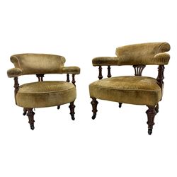 Victorian pair of mahogany armchairs, upholstered in gold velvet fabric, each with curved back, pierced splat and scroll arms, one with rounded seat and the other square, on turned front supports with castors