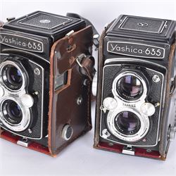 Two Yashica-635 Copal-MXV medium format TLR film cameras, circa 1970s, serial nos. ST 4041084 & SX 0031728, each with twin Yashikor 1:3.5 f-80mm lenses, in leather carry cases