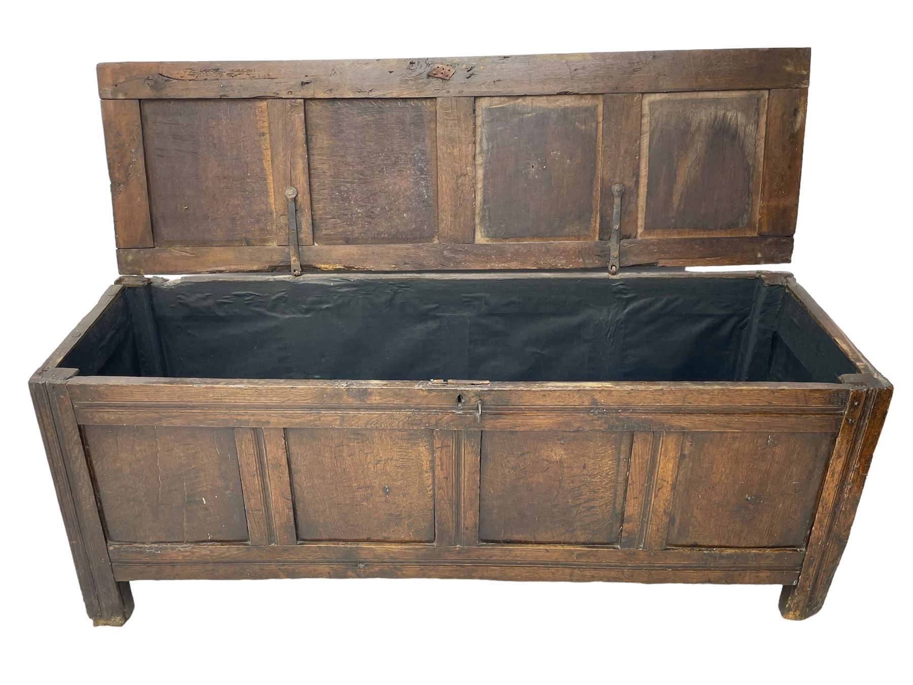 17th century panelled oak blanket chest or kist, quadruple panelled hinged lid over quadruple panelled front, moulded frame and pegged construction, on stile supports