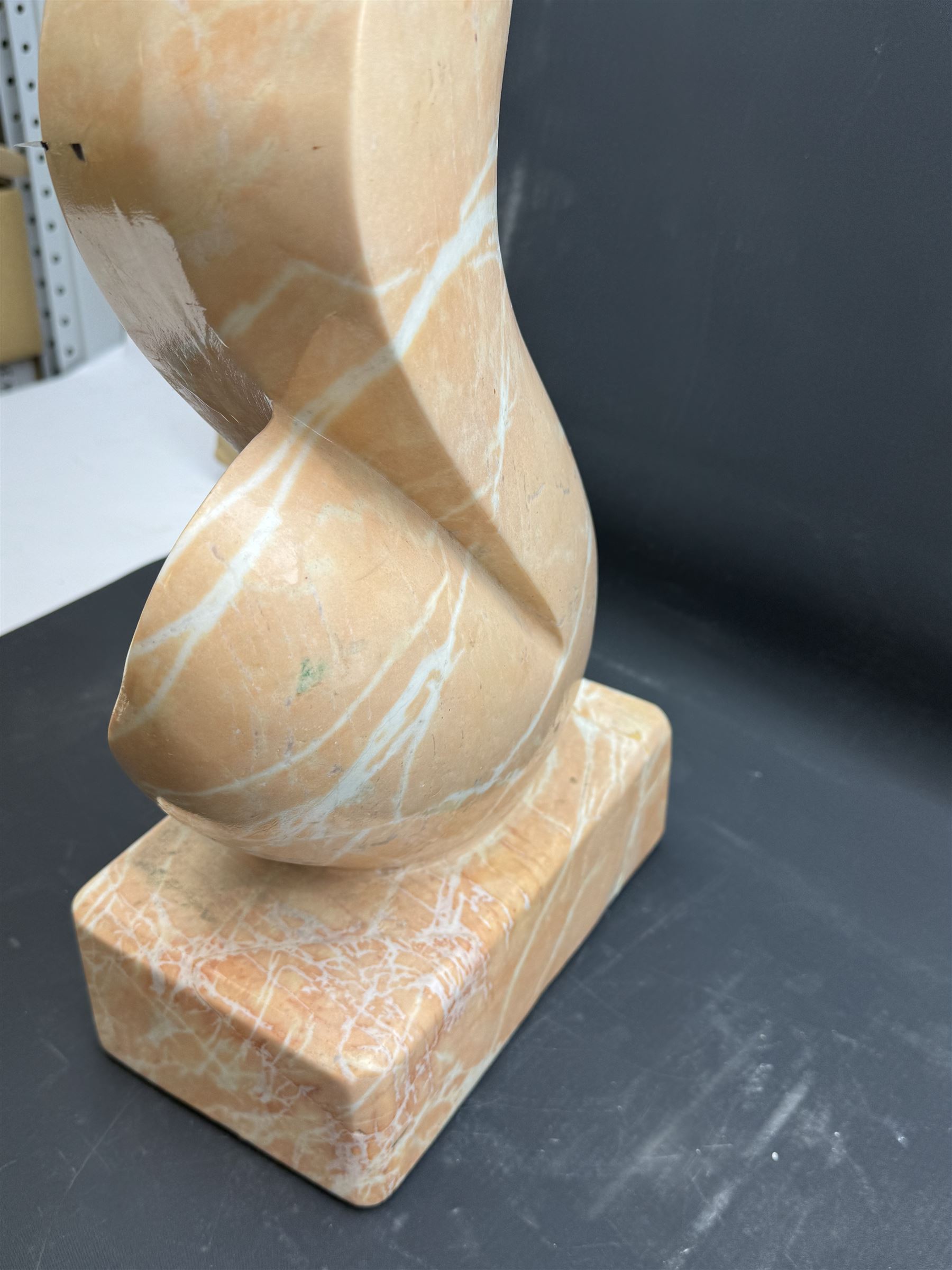 Abstract pink marble sculpture, upon a rectangular base, H63cm