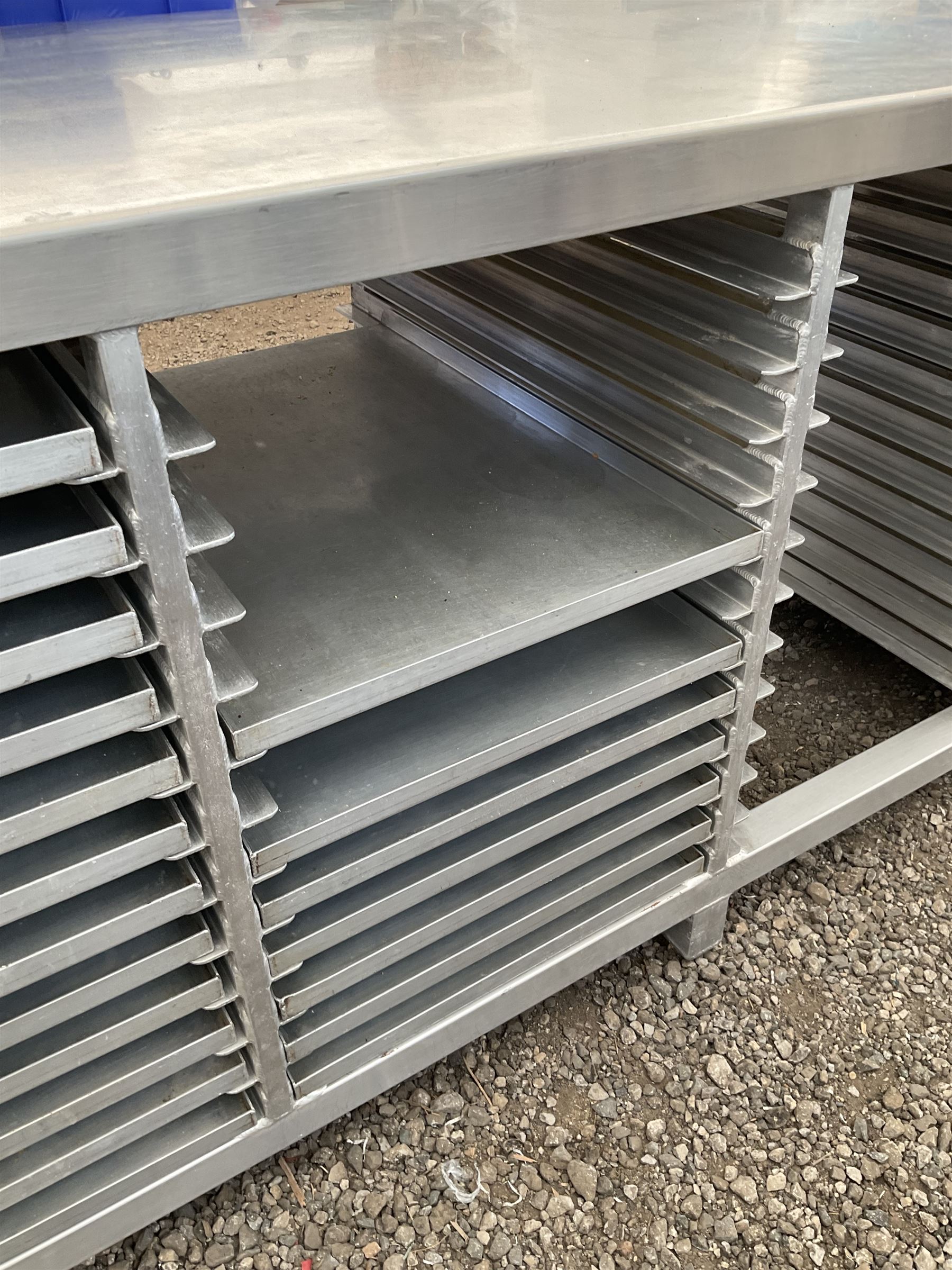 Aluminium framed and stainless steel commercial tray rack preparation table, 48 tray capacity, complete with 30 trays, trays size 66cm x 46 cm - THIS LOT IS TO BE COLLECTED BY APPOINTMENT FROM DUGGLEBY STORAGE, GREAT HILL, EASTFIELD, SCARBOROUGH, YO11 3TX