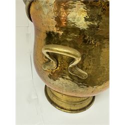 Middle eastern copper bucket, with chased and embossed band of animal decoration, together with a copper jardinière embossed with floral panels, copper plate with embossed leaf motif and two brass helmet shaped coal scuttles, bucket H26cm