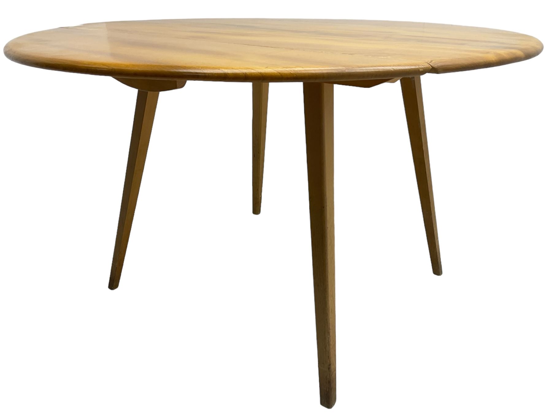 Ercol - mid-20th century golden elm drop-leaf dining table, circular top over splayed supports