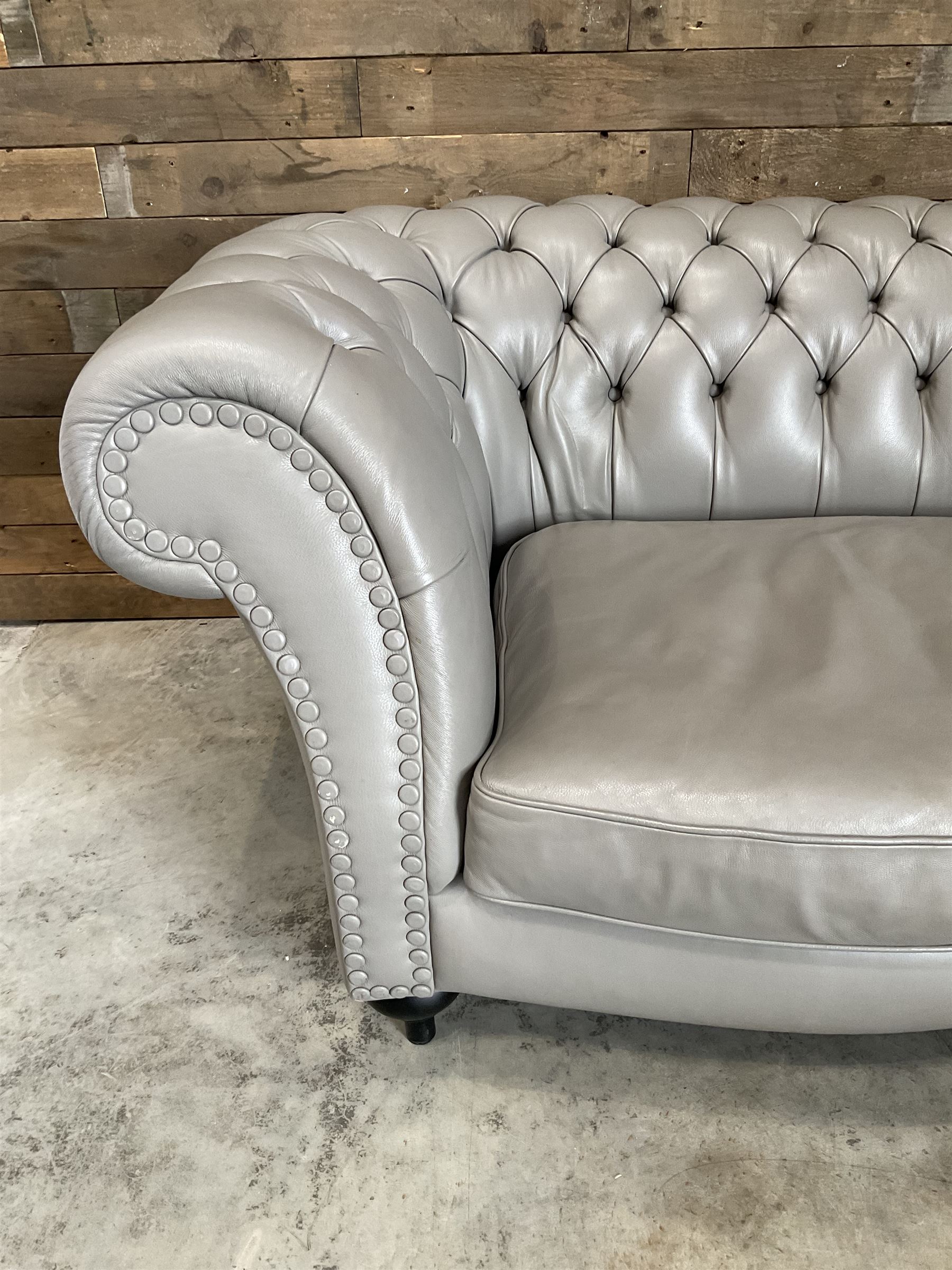 Three seat Chesterfield sofa, upholstered in grey buttoned leather