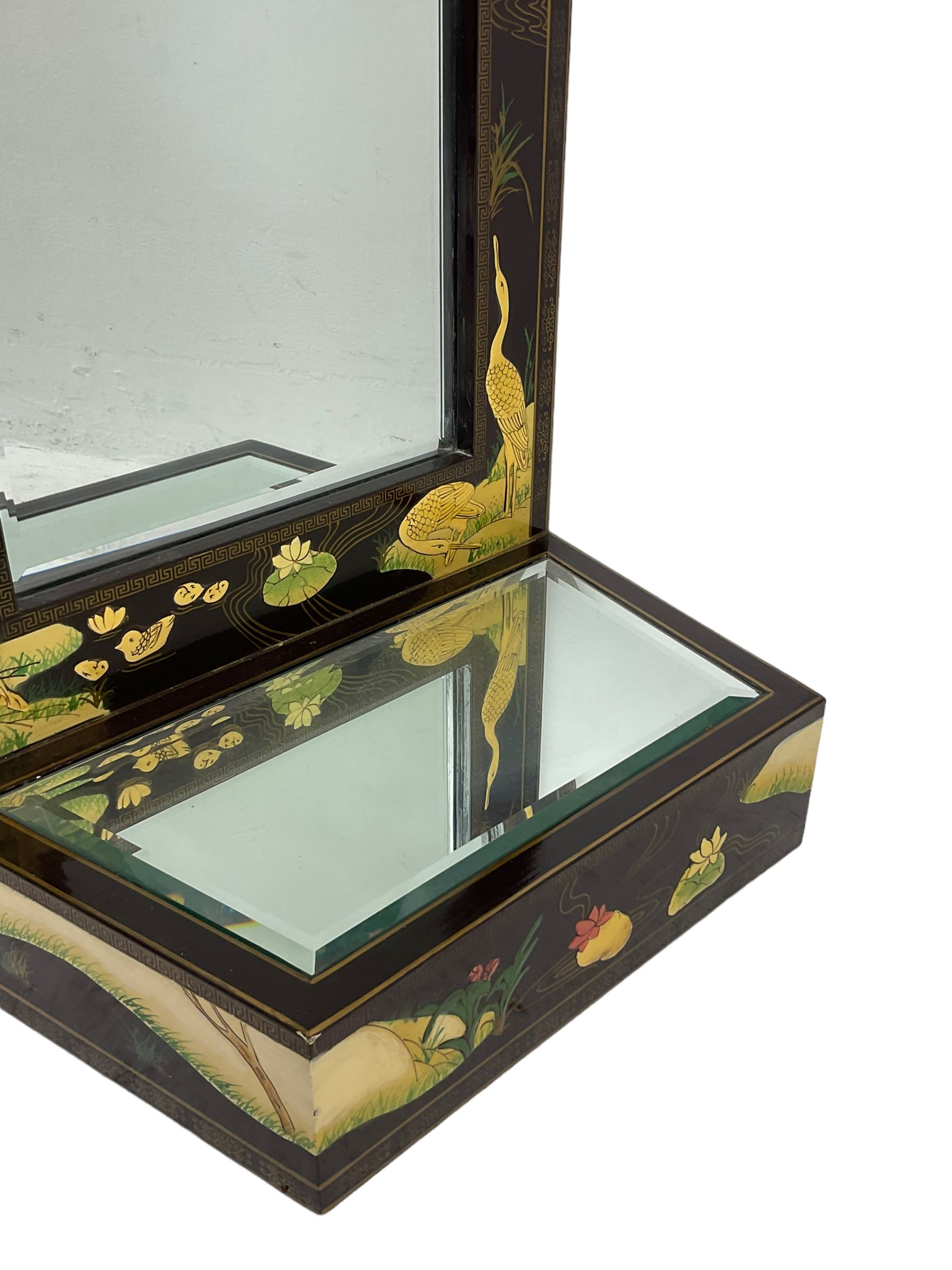 Chinoiserie design wall hanging mirror with shelf, the rectangular frame with raised decoration depicting birds and landscapes, fitted with bevelled glass 