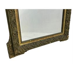 Victorian giltwood and gesso wall mirror, pierced shell cartouche pediment decorated with C-scrolls and curled leaves, moulded frame with curled acanthus leaf decoration and beaded inner slip, the corner brackets decorated with flower heads 