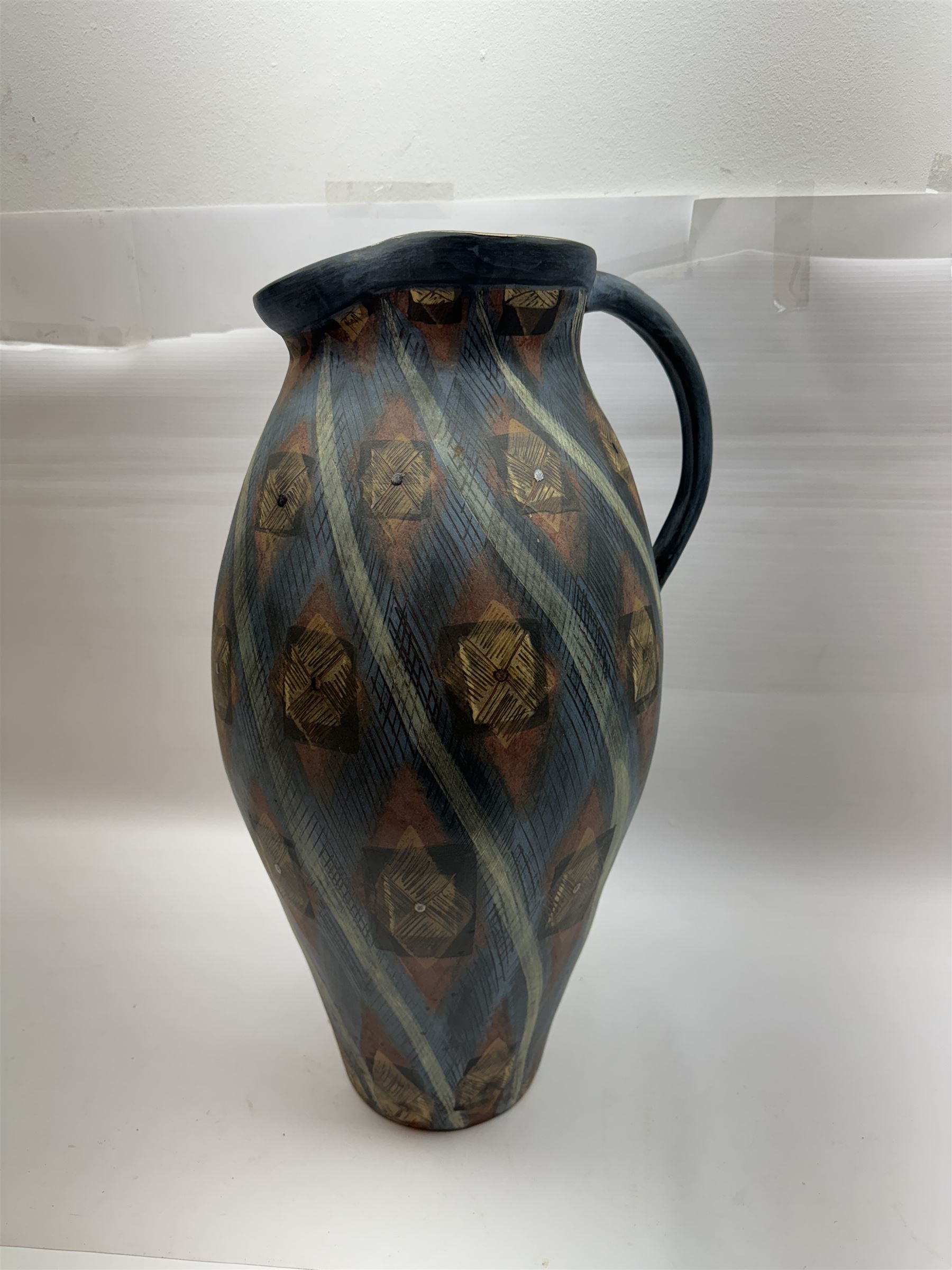 Jackie Walton; Studio pottery large jug decorated with geometric patters, together with another Jackie Walton vase, jug H52cm