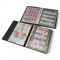 Mostly Queen Elizabeth II mint decimal commemorative 'smilers' stamp sheets, with 1st and 2nd class examples and a small number of other stamp interest items, housed in two ring binder folders