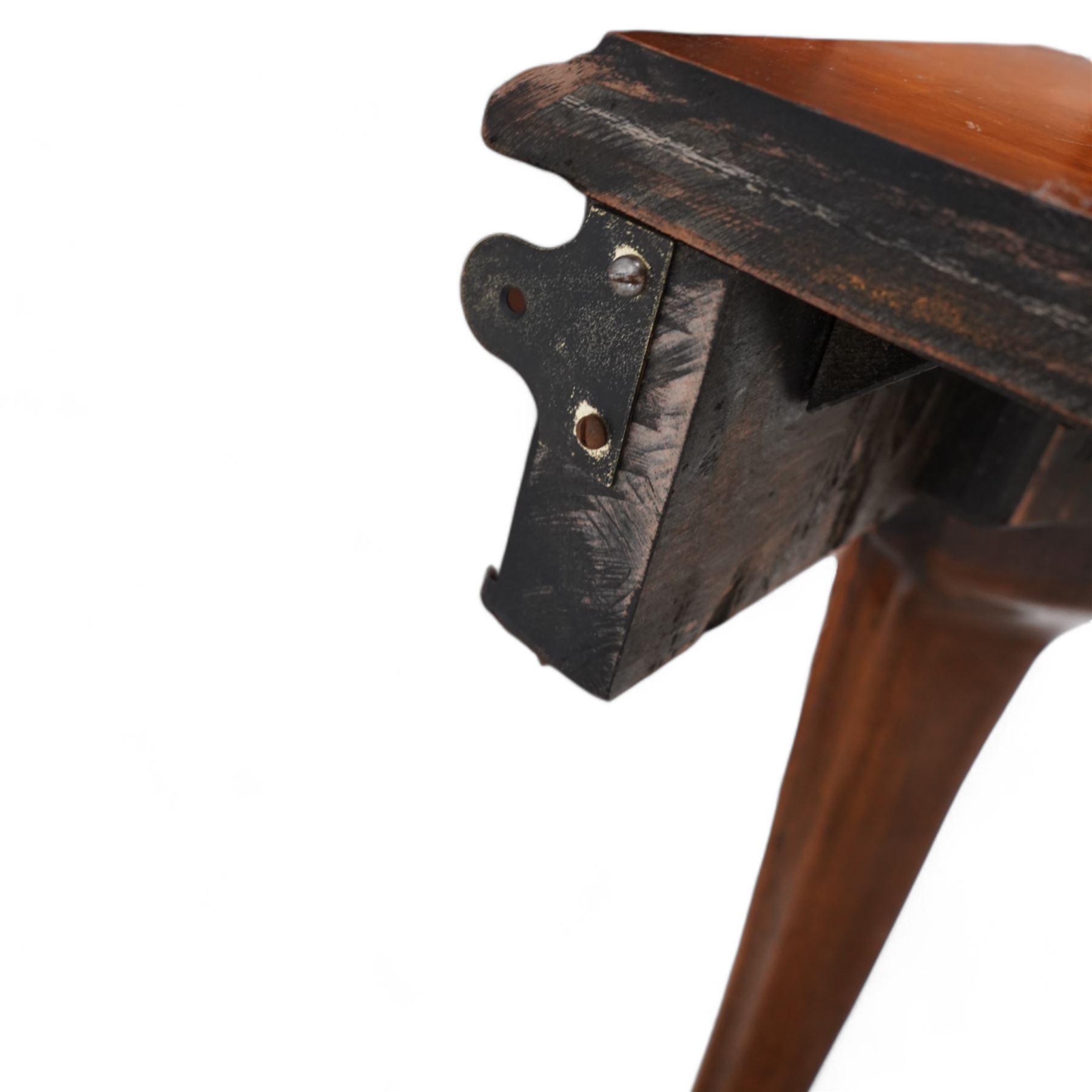 Pair of Georgian walnut console tables, the shaped rectangular cross-banded top with moulded edge over a banded frieze, raised on moulded cabriole supports decorated with scalloped shell and scroll carved knees, terminating to hairy hoof feet