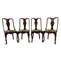 Set of eight late 19th century mahogany spoon back dining chairs, each with shaped top rail over Queen Anne design vase-shaped splat, upholstered seats in floral patterned fabric, raised on cabriole supports with scroll carved knees