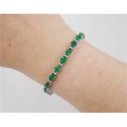 18ct white gold oval cut emerald and round brilliant cut diamond bracelet, stamped, total emerald weight approx 8.15 carat