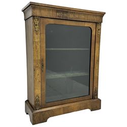 Late Victorian walnut pier cabinet, projecting cornice over frieze inlaid with foliate motifs, single glazed door flanked by ormolu mounts, enclosing shelved interior, on plinth base