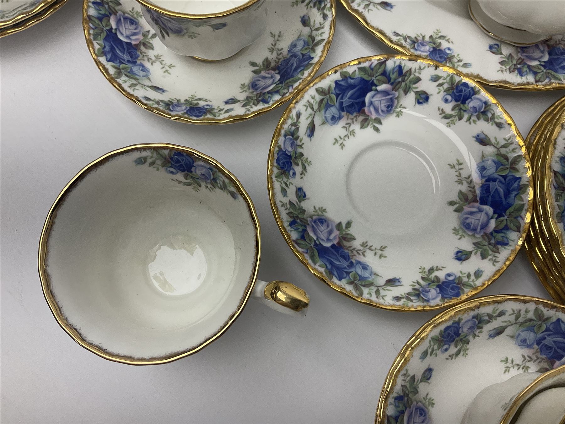 Royal Albert Moonlight Rose pattern tea service for six, comprising teacups and saucers, open sucrier, milk jug, dessert plates and cake plate, together with six other dinners wares in the same pattern