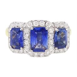 18ct gold sapphire and diamond cluster ring, three emerald cut sapphires, with round brill...