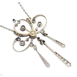 Early 20th century platinum and silver diamond pendant, four milgrain set old cut diamonds of approx 0.40 carat, with rose and old cut diamond set openwork surround, suspending three kite shaped pendants set with diamonds, on detachable screw back platinum trace link chain necklace