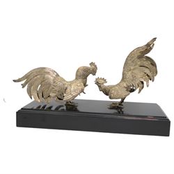 'The Northern Goldsmiths Sweepstakes 1975, Winner Aviator, Owner Guy Reed, Trainer Sam Hall' - A silver trophy modelled as two fighting cockerels on an ebonised plinth with plaque H24cm x W38cm import mark and makers mark for Israel Freeman & Son