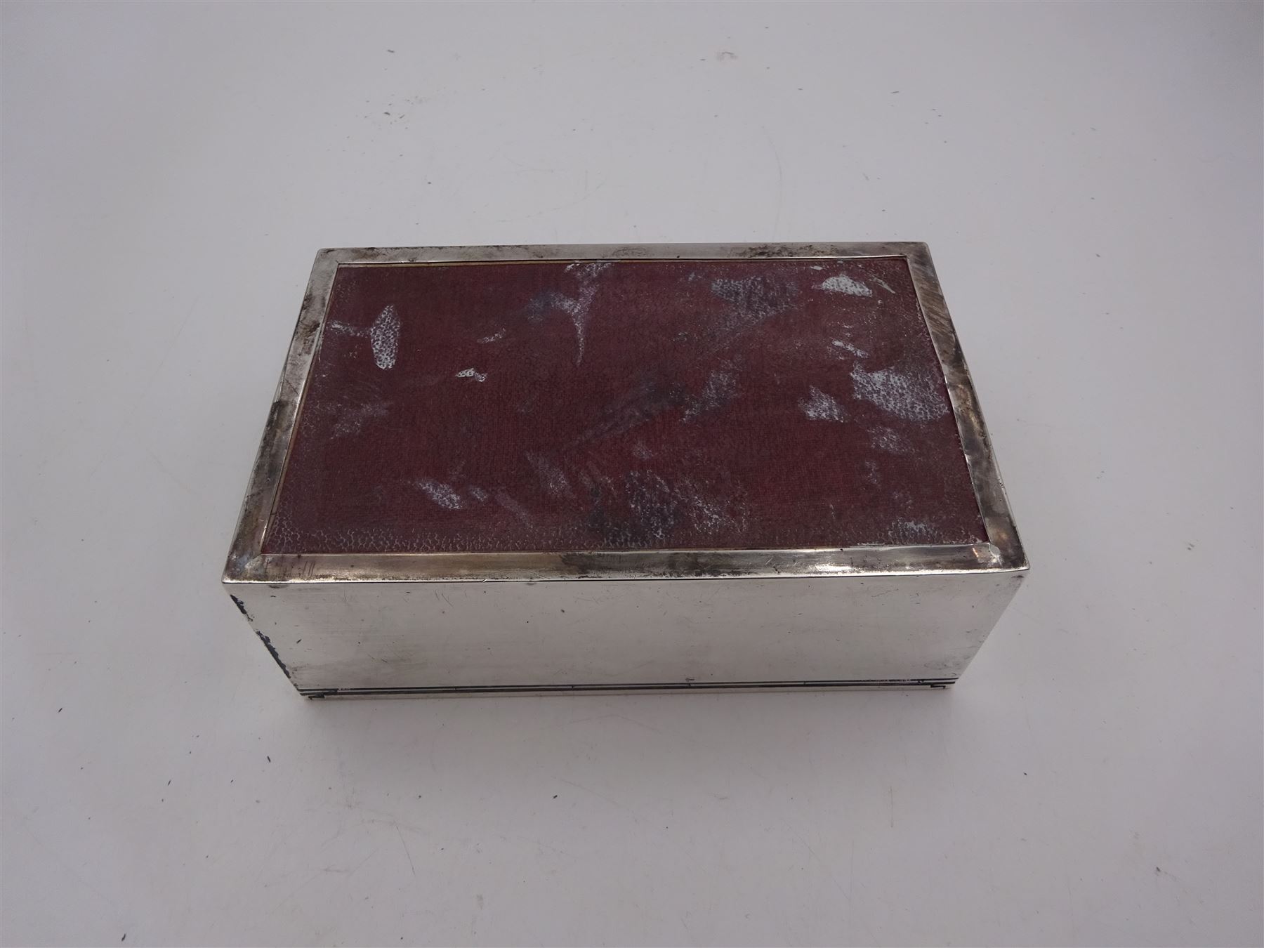 1930s silver mounted cigarette box, of rectangular form, with engine turned decoration and engraved cartouche to hinged lid, opening to reveal a softwood interior, hallmarked London 1930, maker's mark worn and indistinct