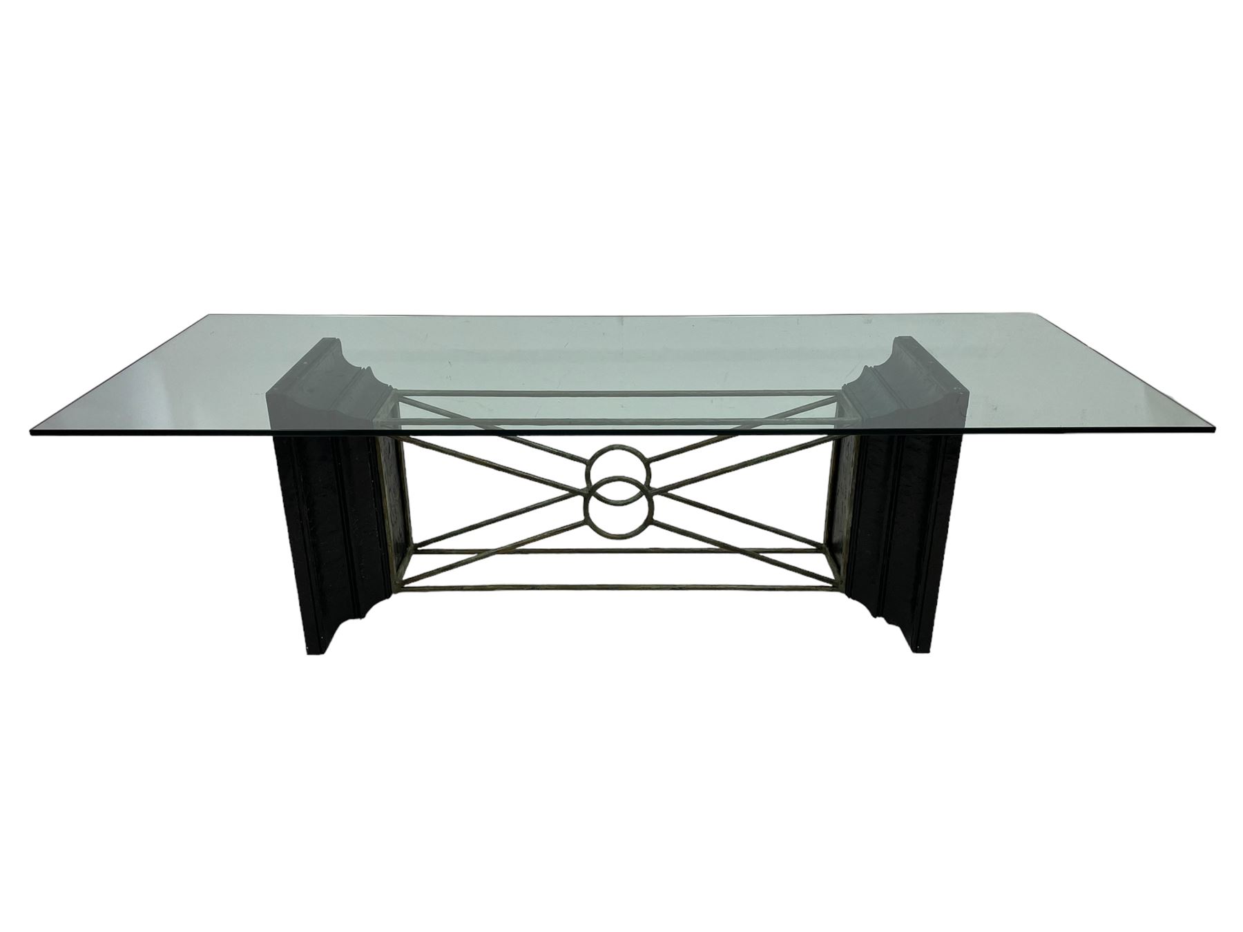 Tempus Stet - 'The Corinth Architectural' dining table, rectangular glass top on moulded composite end supports inset with bronzed metal panels, united by metal stretchers 