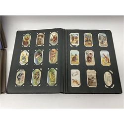 Four albums of cigarette cards, including Will's and Player's examples