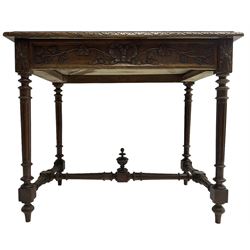 19th century walnut side table,  rectangular top with lunette carved moulded edge, the frieze drawer carved with ribbon and extending vine branch and grapes, on turned and fluted supports united by fluted stretcher with centre finial 