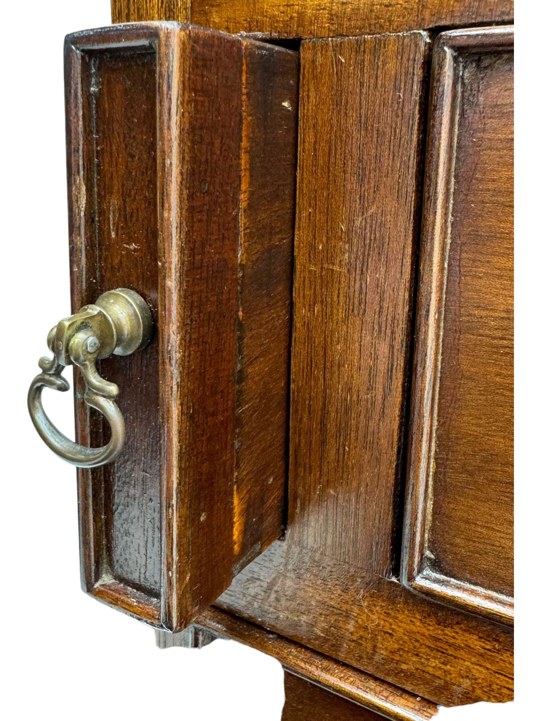 Mid-to-late 20th century inlaid mahogany bureau, inlaid floral medallion to the top, the fall front opening to reveal fitted interior with pigeonholes, small drawers and central cupboard, green inset writing surface with gilt tooling, four drawers below with brass handles, raised on shaped bracket feet