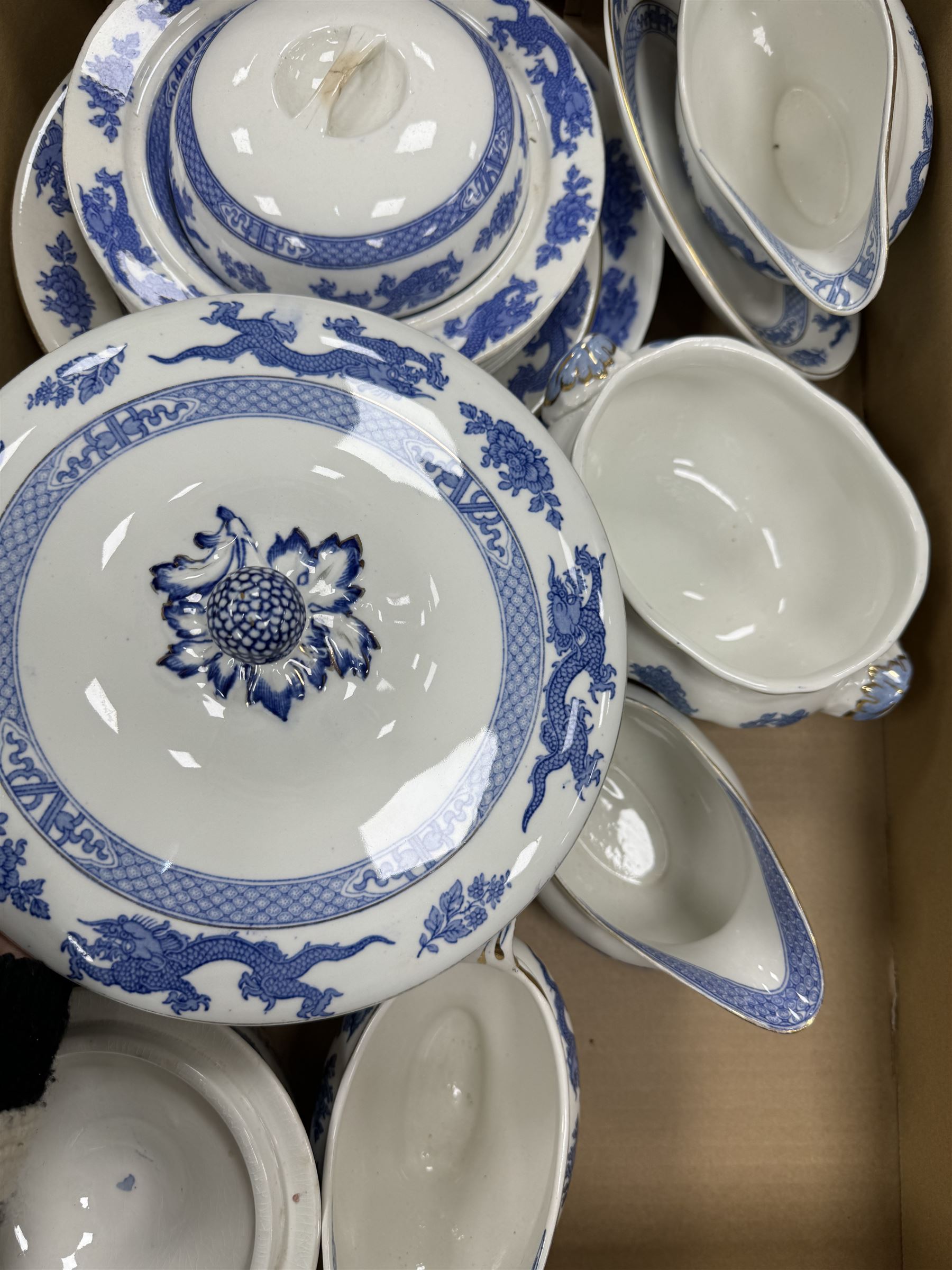 Extensive tea and dinner service of Booths and Cauldon dragon pattern, including, teapots, coffee pots, jugs, toast racks, bowls, dinner plates, platters, soup tureen etc 