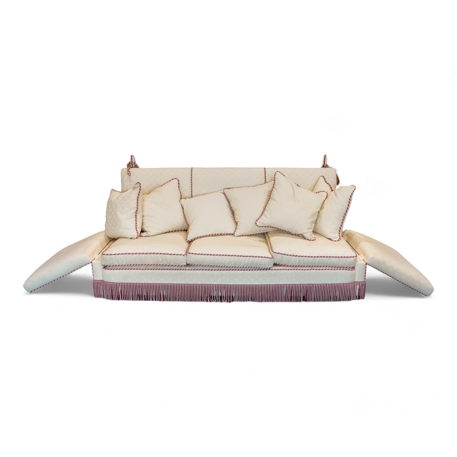 Grande Knole four-seat sofa, upholstered in geometric lozenge pattern cream fabric with burgundy and cream twist piping and fringe, on castors