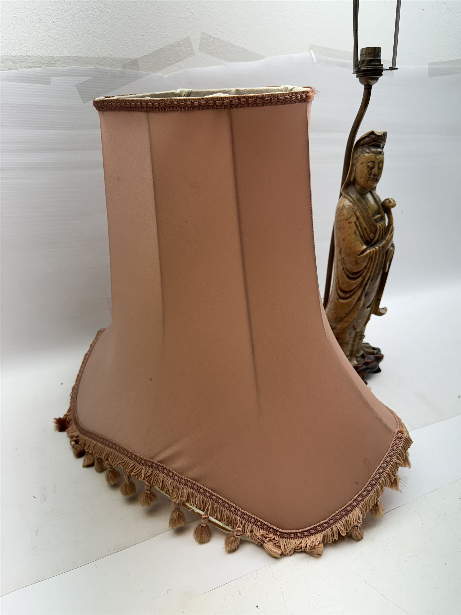 Carved soapstone lamp modelled as Guan Yin, upon hardwood base, with pink fabric shade, including shade H77.5cm