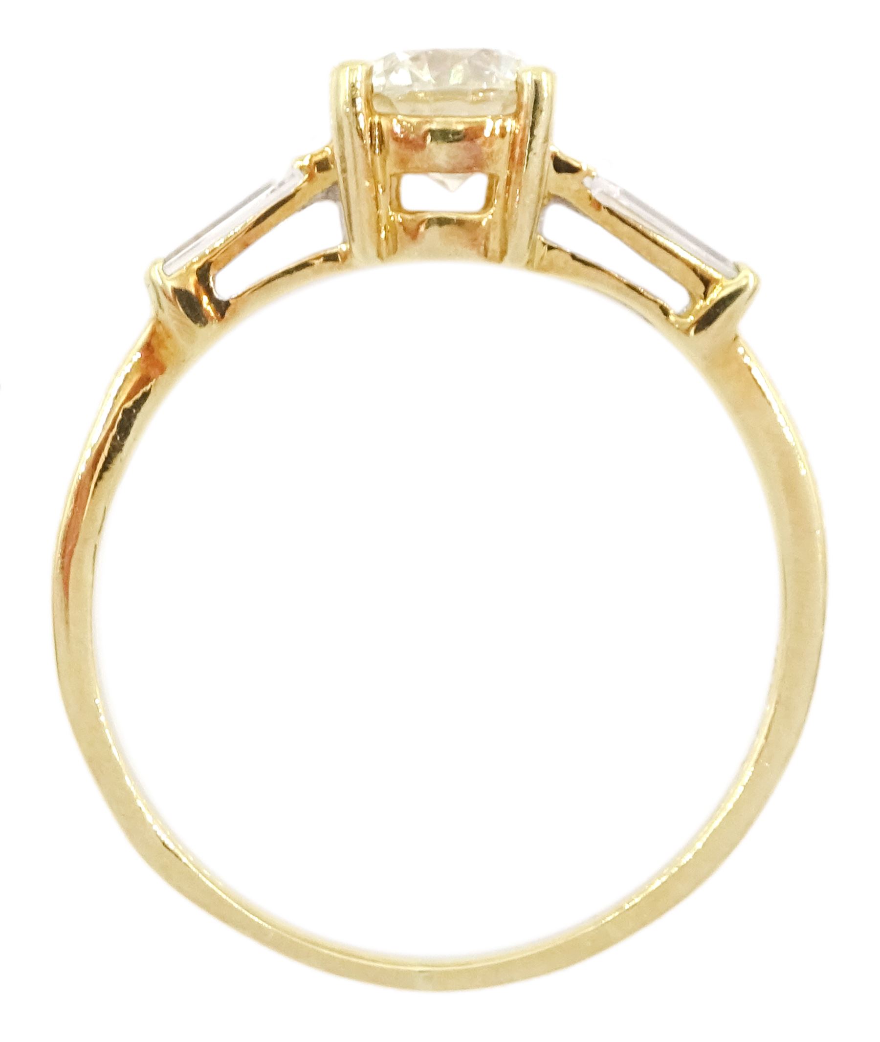 18ct gold single stone round brilliant cut diamond ring, with tapered baguette diamond shoulders, stamped 750, principal diamond approx 0.65 carat, total diamond weight approx 0.85 carat