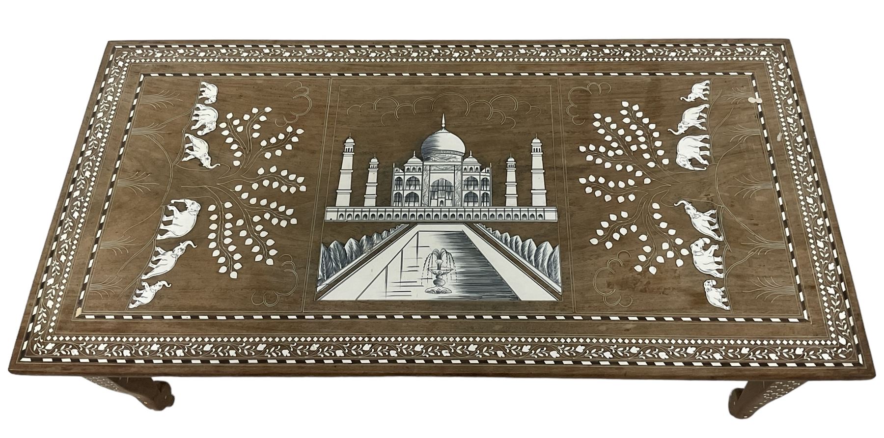 20th century Indian inlaid hardwood coffee table, rectangular top decorated with simulated ivory inlays depicting the Taj Mahal and elephants