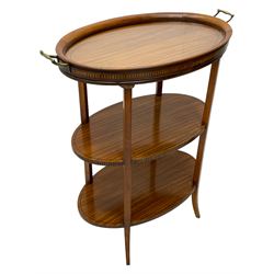 Edwardian satinwood tray top stand of oval form, tray top with glazed base and brass handles over two tiers, each with checkered inlaid band, on square tapering and splayed supports