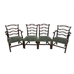 Set of twelve (10+2) Chippendale revival stained beech dining chairs, pierced waived ladder backs with over-stuffed over seats, on square moulded supports joined by stretchers