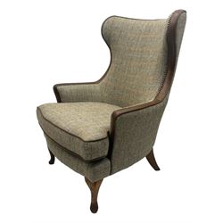 Wood Bros - contemporary wingback armchair, high back with curved wings upholstered in herringbone patterned fabric, accented with leather trim and brass nailhead studs, resting on cabriole front feet 