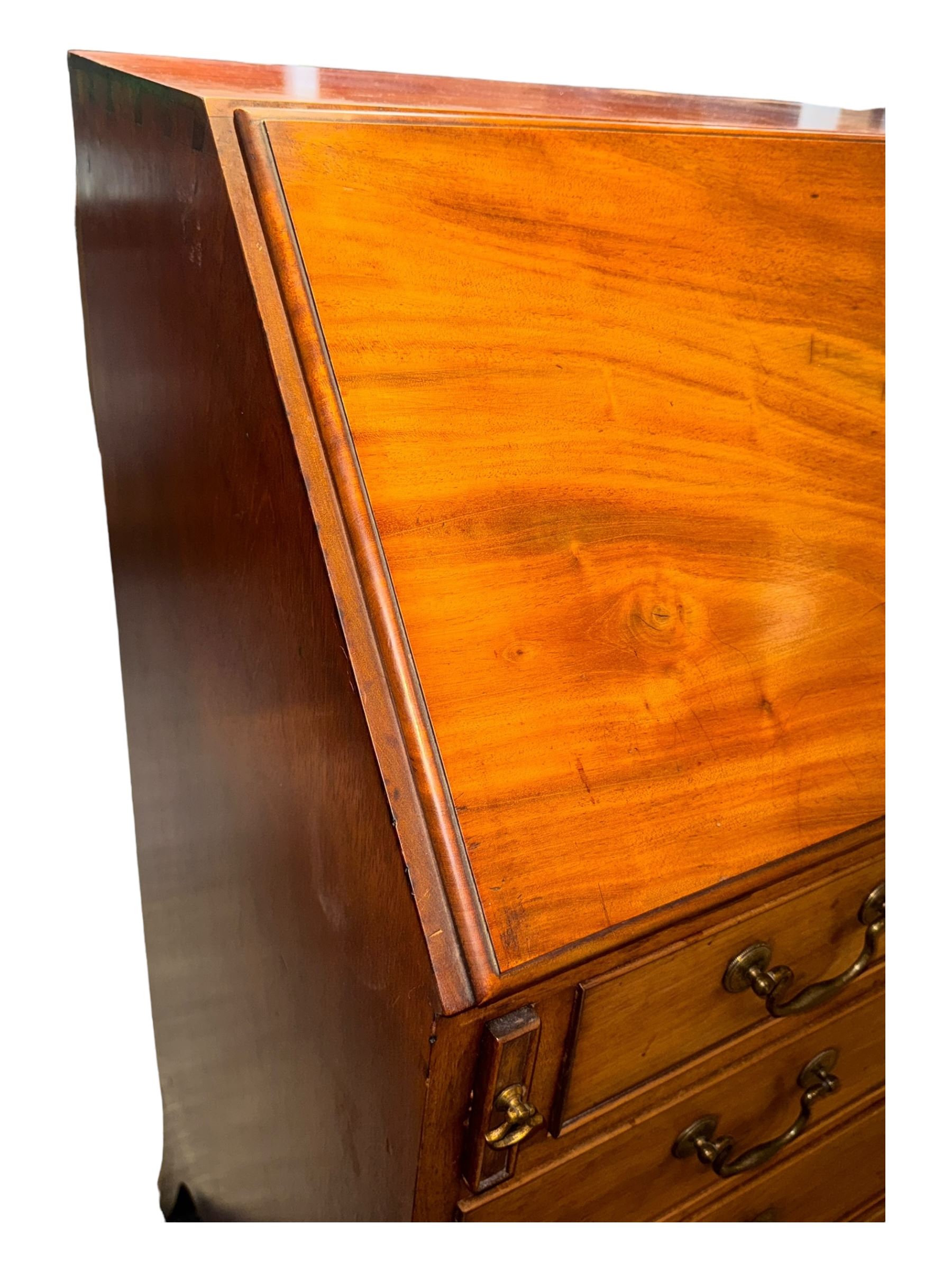 Georgian mahogany bureau, moulded fall front enclosing cupboard, small drawers, pigeonholes and inset writing surface, fitted with four long graduating cock-beaded drawers, on splayed bracket feet 