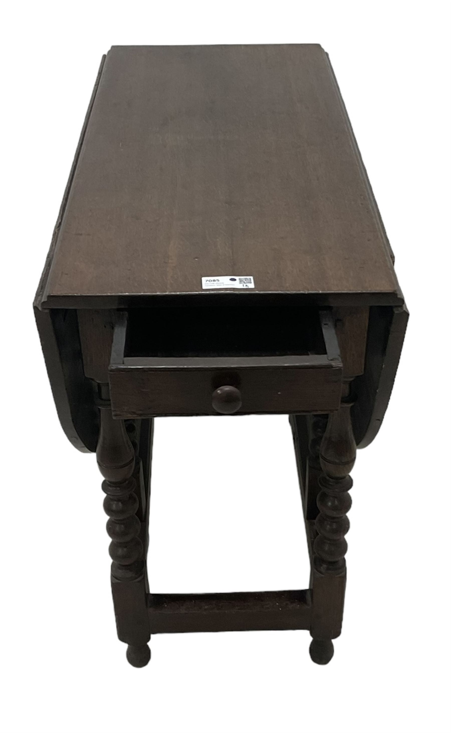 18th century country oak drop-leaf table, oval top, fitted with single drawer, raised on double gate-leg action bobbin-turned supports, united by stretchers