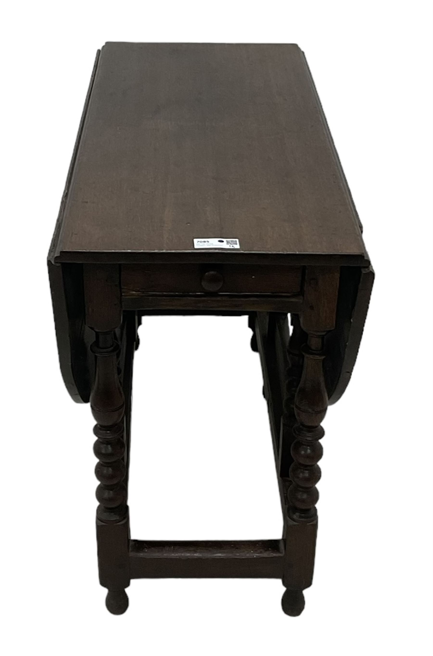 18th century country oak drop-leaf table, oval top, fitted with single drawer, raised on double gate-leg action bobbin-turned supports, united by stretchers